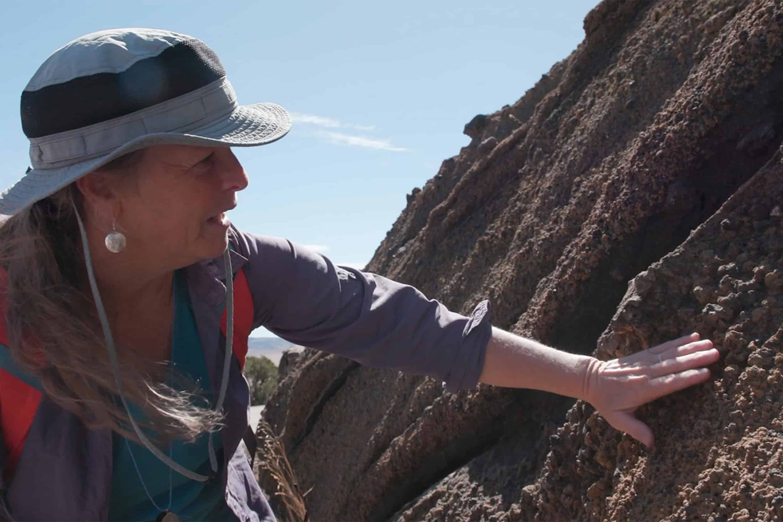 female geologist at rock