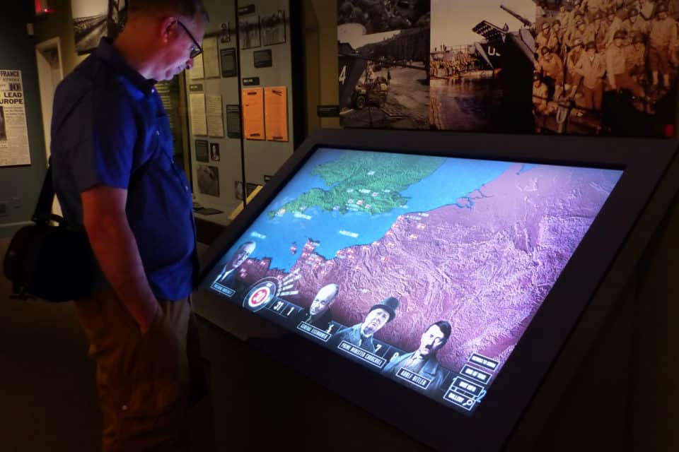 man at interactive touchscreen
